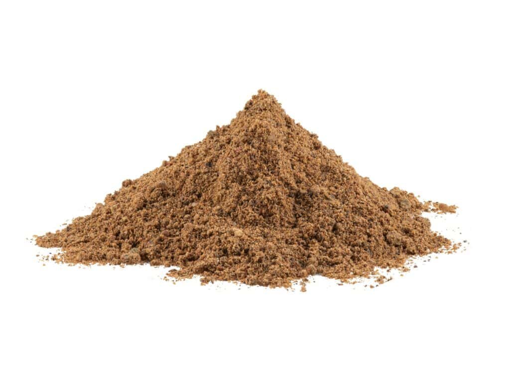 Freshly ground brown spice powder for cooking and flavor enhancement.